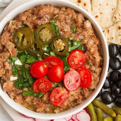  Ful Medames: Een romige bonenschotel die je smaakpapillen een exotische dans zal laten uitvoeren!